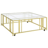 Furniture City Houma - Coaster - Adri Square Glass Top Coffee Table with Casters Matte Brass - 710188