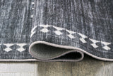 Arloman - 5' x 7' Rug - Black / Cream / Gray