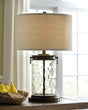 Furniture City Houma - Ashley Furniture - Tailynn Table Lamp (Set of 2) - Table Lamp (Set of 2) / Clear/Bronze Finish - L430324X2