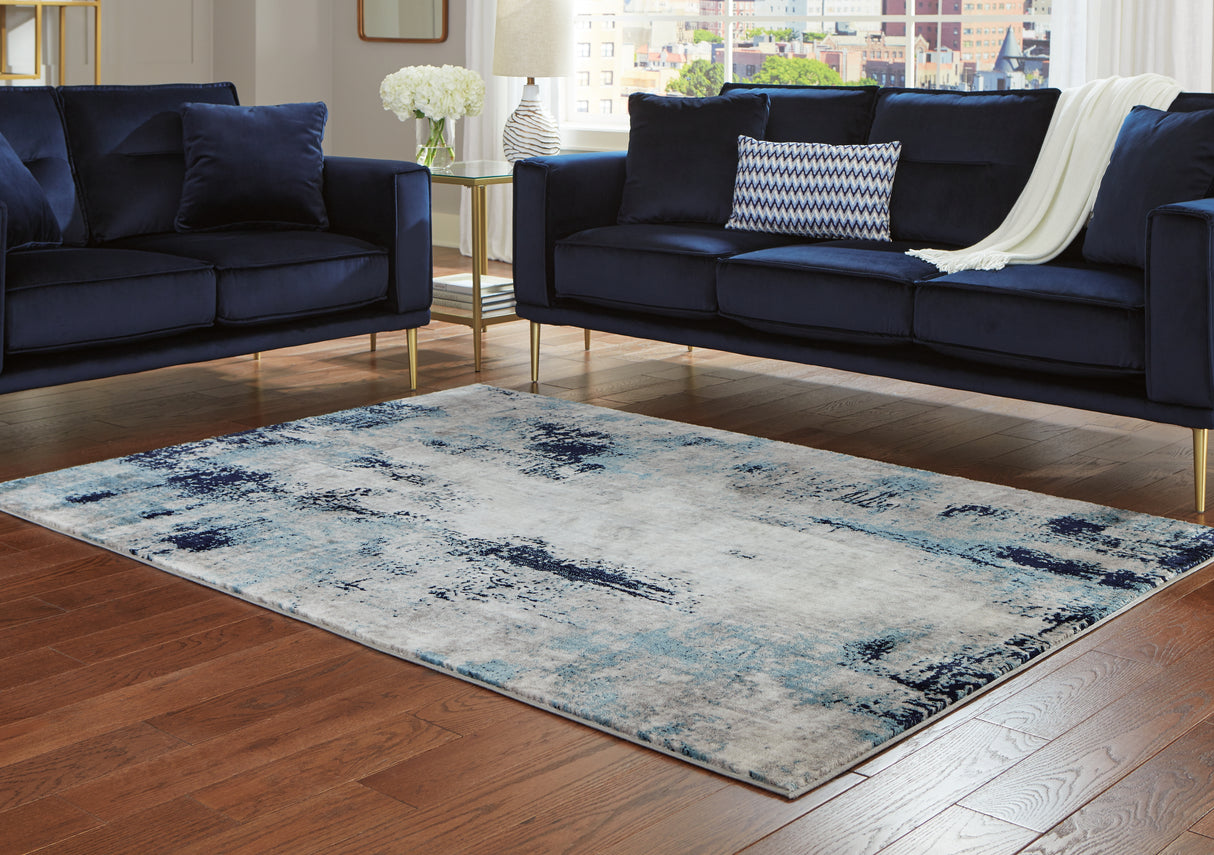 Furniture City Houma - Ashley Furniture - Leonelle Rug - 7'10" x 10' Rug / White/Blue/Gray - R404871