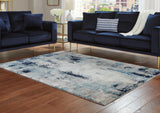 Furniture City Houma - Ashley Furniture - Leonelle Rug - 7'10" x 10' Rug / White/Blue/Gray - R404871