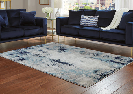 Furniture City Houma - Ashley Furniture - Leonelle 7'10" x 10' Rug - 7'10" x 10' Rug / White/Blue/Gray - R404871