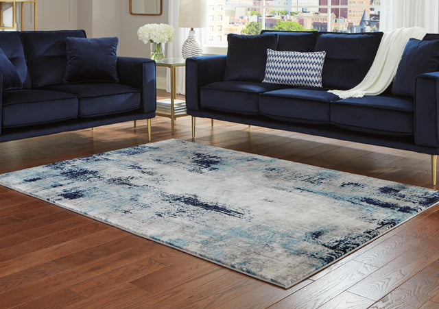 Furniture City Houma - Ashley Furniture - Leonelle 7'10" x 10' Rug - 7'10" x 10' Rug / White/Blue/Gray - R404871