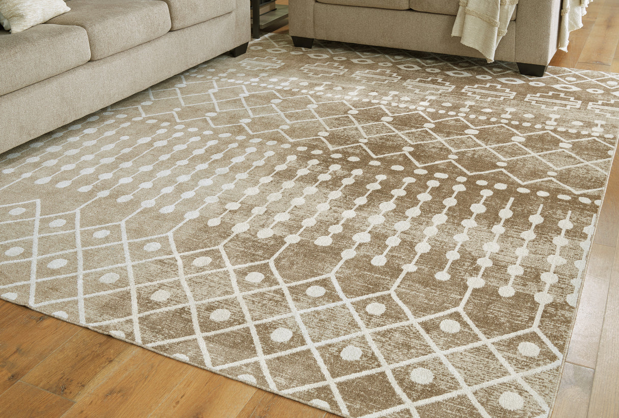 Furniture City Houma - Ashley Furniture - Bunchly Rug - 7'10" x 10'3" Washable Rug / Tan/Brown/Cream - R406221