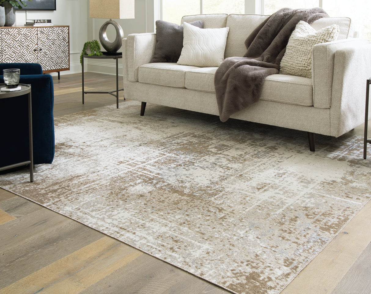 Furniture City Houma - Ashley Furniture - Grifflain Rug - 7'10" x 10'3" Washable Rug / Tan/Brown/Gray - R406231