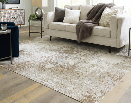 Furniture City Houma - Ashley Furniture - Grifflain Rug - 7'10" x 10'3" Washable Rug / Tan/Brown/Gray - R406231