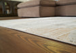 Furniture City Houma - Ashley Furniture - Truward 8' x 10' Rug - 8' x 10' Rug / Linen/Gray/Caramel - R406471