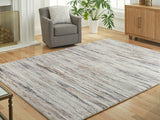 Furniture City Houma - Ashley Furniture - Nace Rug - 7'6" x 9'6" Area Rug / Gray/Brown/White - R407471