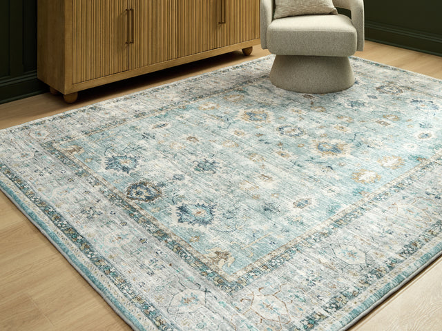 Furniture City Houma - Ashley Furniture - Ladstoney 7'6" x 9'6" Area Rug - 7'6" x 9'6" Area Rug / Teal/Beige/Ochre - R407501