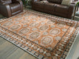 Furniture City Houma - Ashley Furniture - Qaabiz 7'8" x 10' Area Rug - 7'8" x 10' Area Rug / Sienna/Ivory/Black - R407521