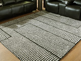 Furniture City Houma - Ashley Furniture - Kurtmen Rug - 5' x 7' Area Rug / Black/Ivory - R407592