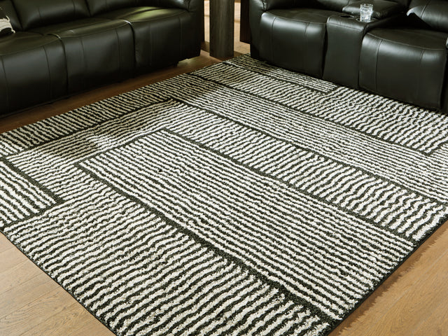 Furniture City Houma - Ashley Furniture - Kurtmen Rug - 5' x 7' Area Rug / Black/Ivory - R407592