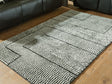 Furniture City Houma - Ashley Furniture - Kurtmen 5' x 7' Area Rug - 5' x 7' Area Rug / Black/Ivory - R407592