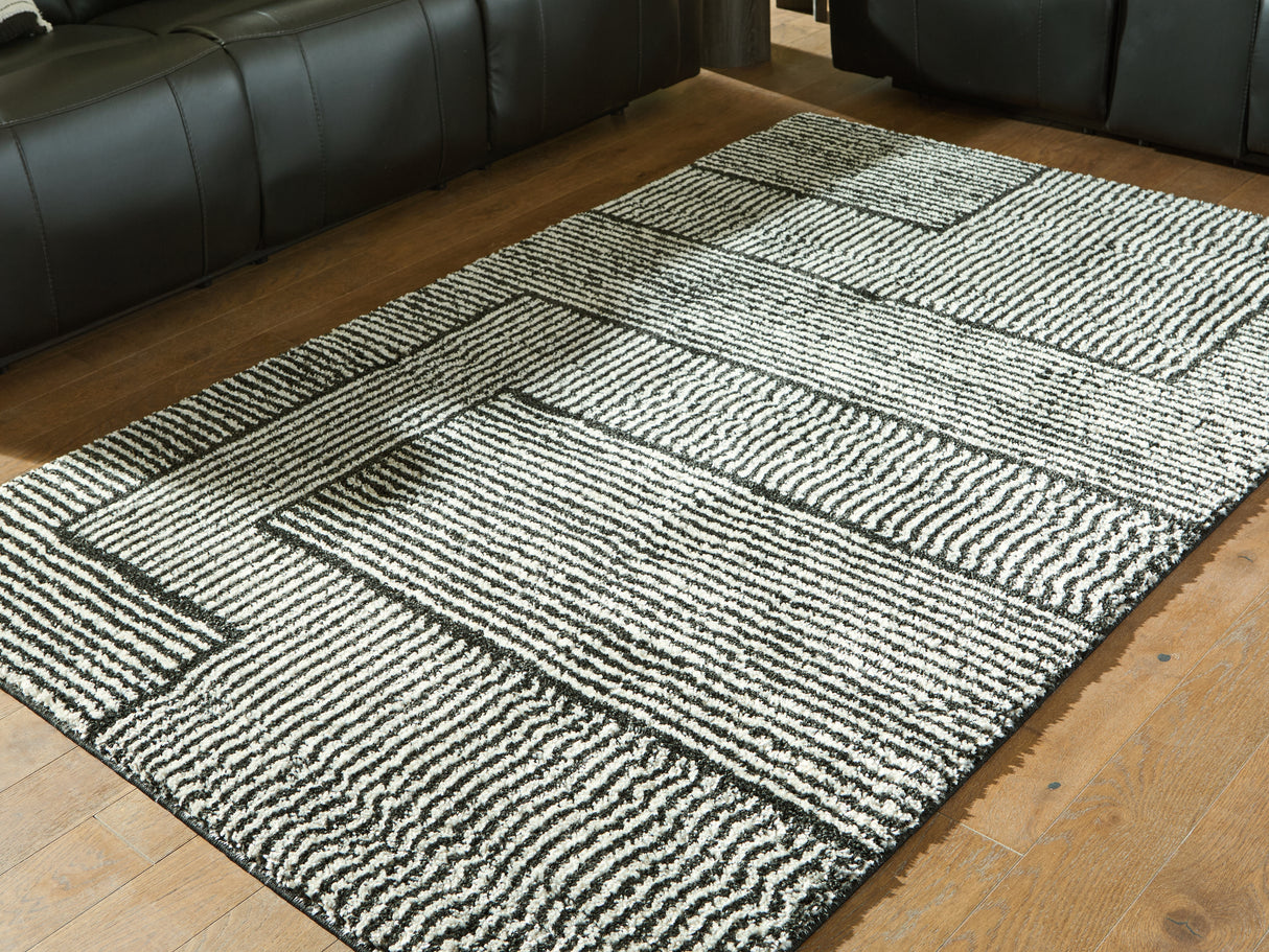 Furniture City Houma - Ashley Furniture - Kurtmen Rug - 5' x 7' Area Rug / Black/Ivory - R407592