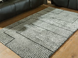 Furniture City Houma - Ashley Furniture - Kurtmen Rug - 5' x 7' Area Rug / Black/Ivory - R407592