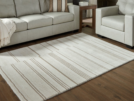 Furniture City Houma - Ashley Furniture - Gadence Rug - 7'8" x 10' Area Rug / Ivory/Tan - R407641
