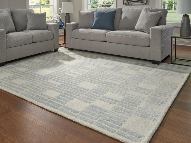 Furniture City Houma - Ashley Furniture - Dylanton Rug - 7'8" x 10' Area Rug / Ivory/Blue - R407811
