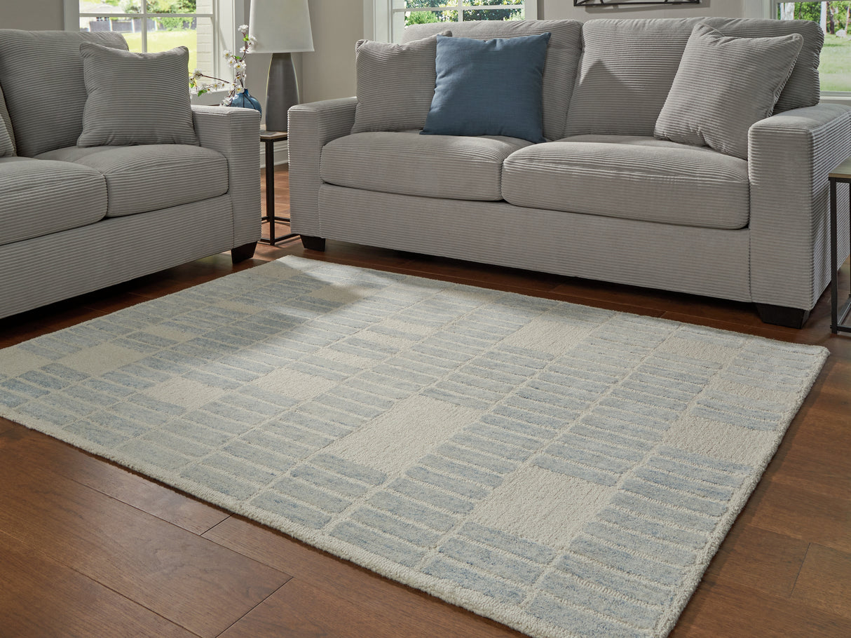 Furniture City Houma - Ashley Furniture - Dylanton Rug - 5' x 7' Area Rug / Ivory/Blue - R407812