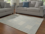 Furniture City Houma - Ashley Furniture - Dylanton Rug - 5' x 7' Area Rug / Ivory/Blue - R407812