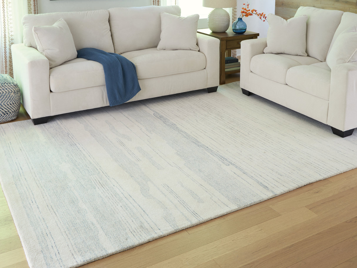 Furniture City Houma - Ashley Furniture - Genemost Rug - 7'8" x 10' Area Rug / Ivory/Blue - R407841